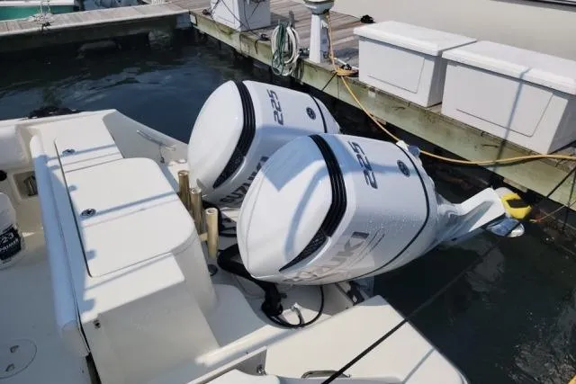 Slide: The Image of 2004 Hydra-Sports Vector 2600 CC with twin outboard engines docked at marina. - 2