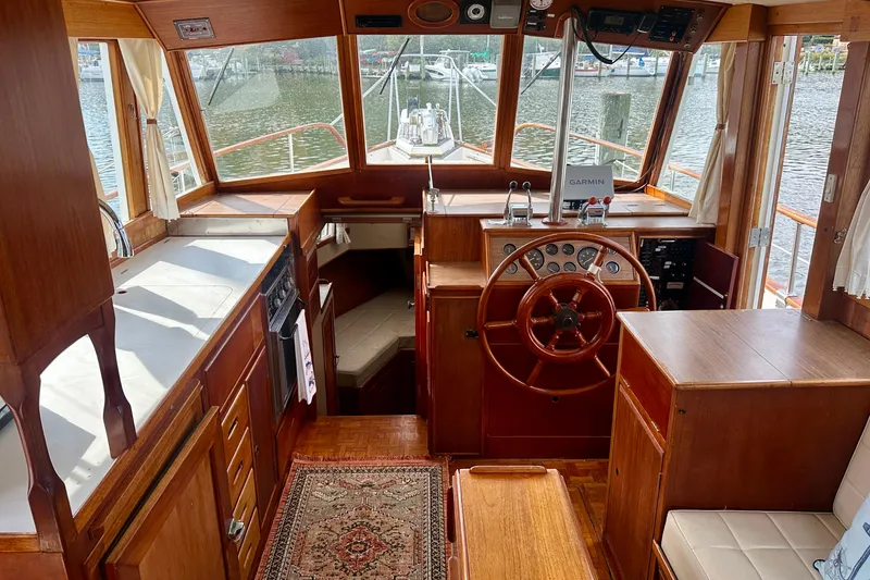 Slide: The Image of Interior of 1988 Grand Banks 36 Classic yacht with wooden helm and navigation equipment. - 18