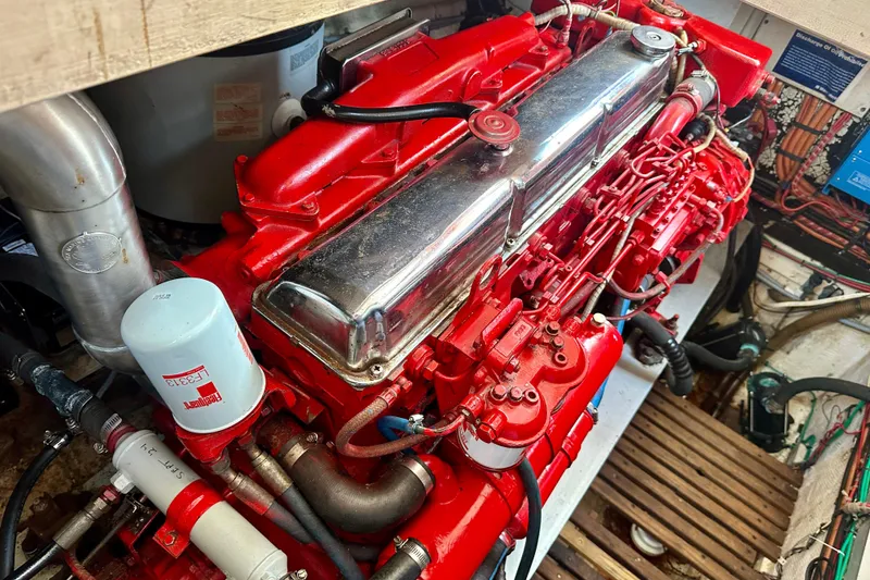 Slide: The Image of Engine of 1988 Grand Banks 36 Classic, featuring vibrant red components and detailed mechanics. - 40