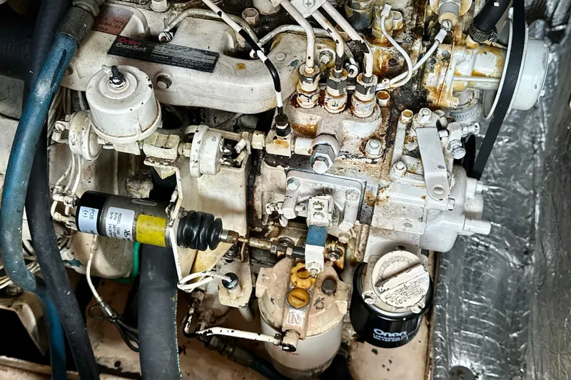 Slide: The Image of Engine compartment of a 1988 Grand Banks 36 Classic boat, showcasing mechanical components. - 44