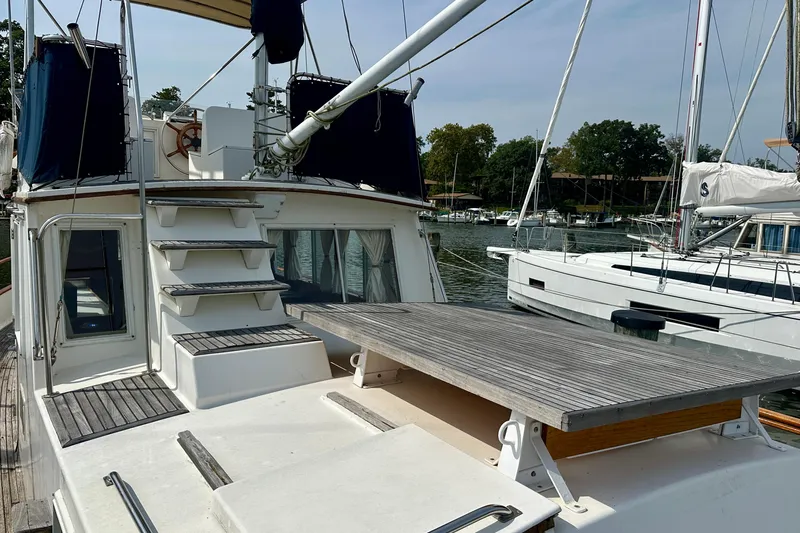Slide: The Image of 1988 Grand Banks 36 Classic yacht with spacious deck and marina view. - 5