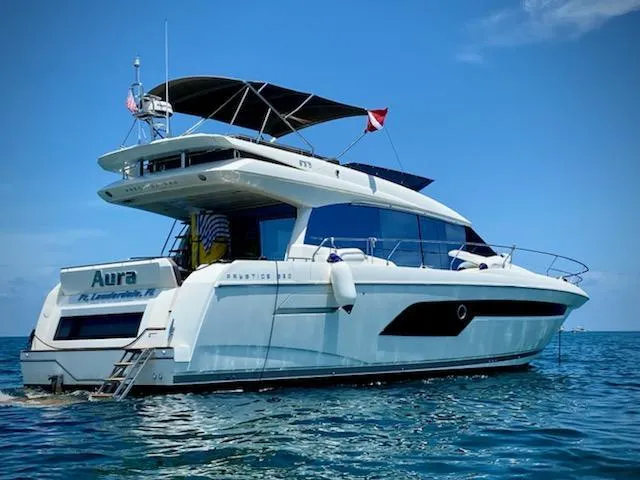 Slide: The Image of Prestige 520 yacht, 2018 model, cruising on clear blue waters under a sunny sky. - 1