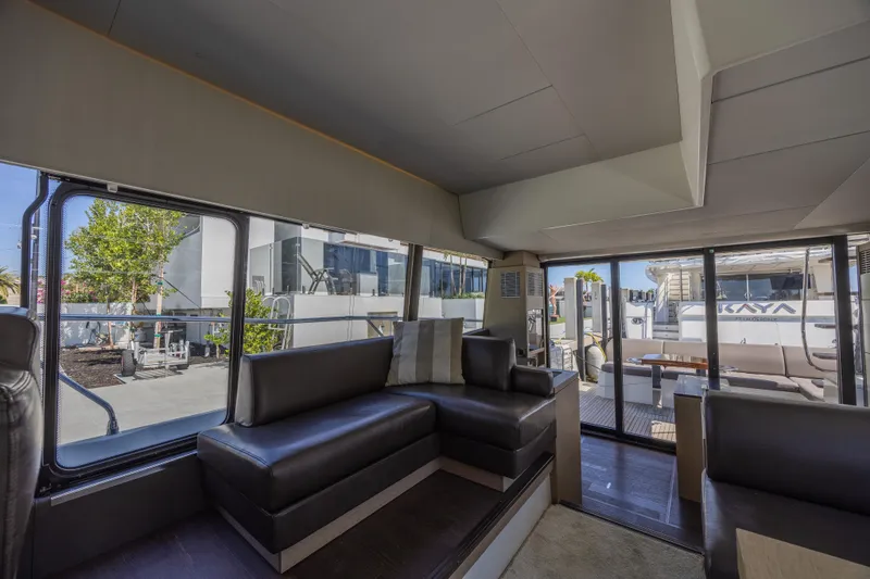 Slide: The Image of Interior of 2018 Prestige 520 yacht with modern seating and large windows. - 23
