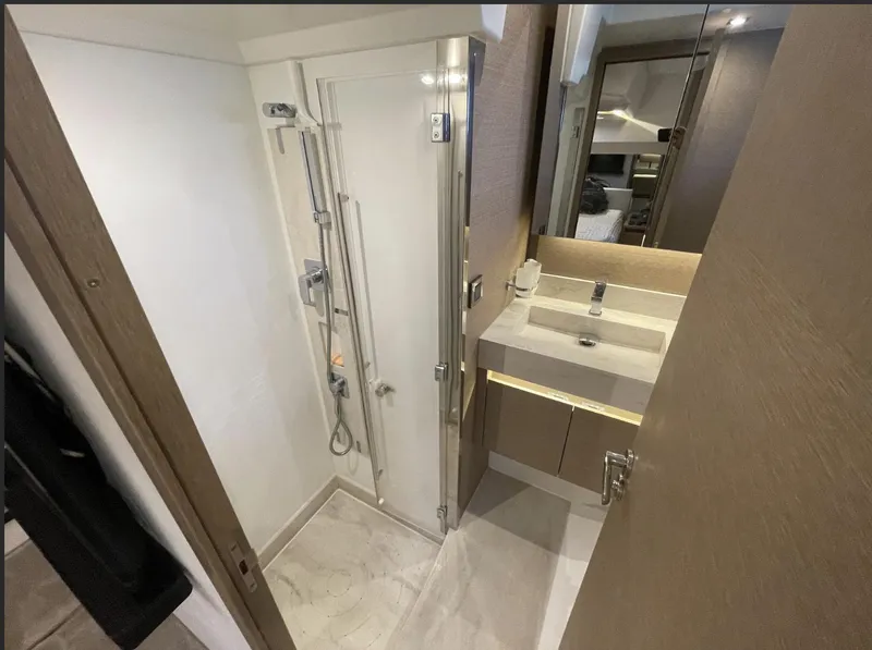 Slide: The Image of Modern bathroom in 2018 Prestige 520 yacht with shower and sink. - 32