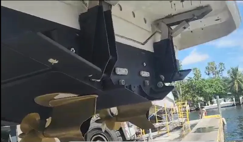 Slide: The Image of 2018 Prestige 520 yacht propellers and stern view at dockside. - 46