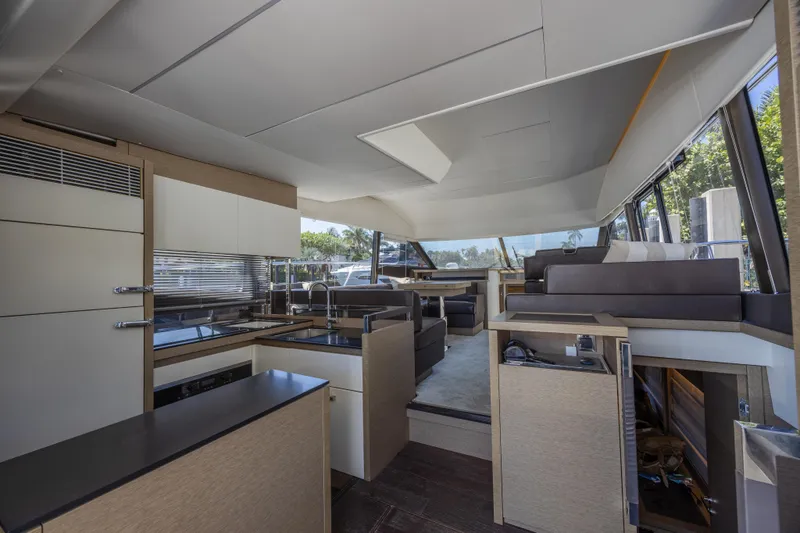 Slide: The Image of Interior of 2018 Prestige 520 yacht, featuring modern kitchen and seating area. - 7