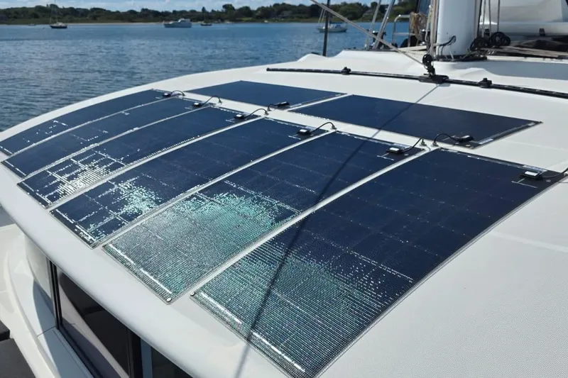 Slide: The Image of Solar panels on 2023 Lagoon 50 catamaran, harnessing renewable energy on the water. - 10