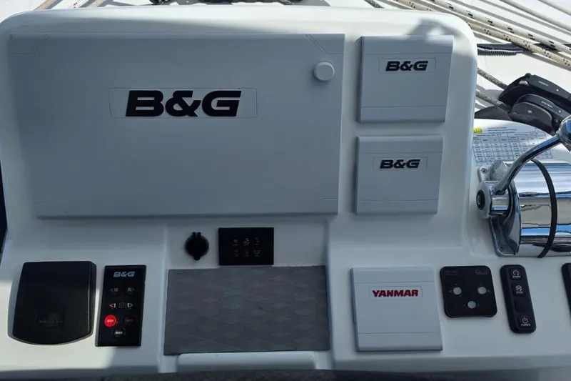 Slide: The Image of Helm controls of 2023 Lagoon 50 catamaran featuring B&G and Yanmar equipment. - 13