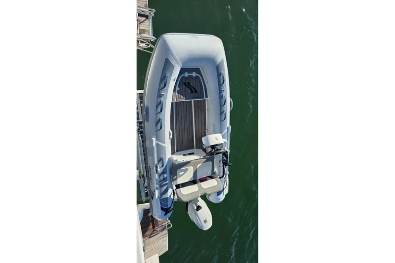 Slide: The Image of Overhead view of 2023 Lagoon 50 boat docked on calm water. - 19