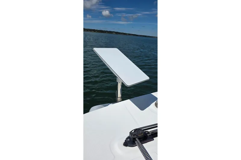 Slide: The Image of Satellite dish on 2023 Lagoon 50 yacht, overlooking calm ocean waters. - 20