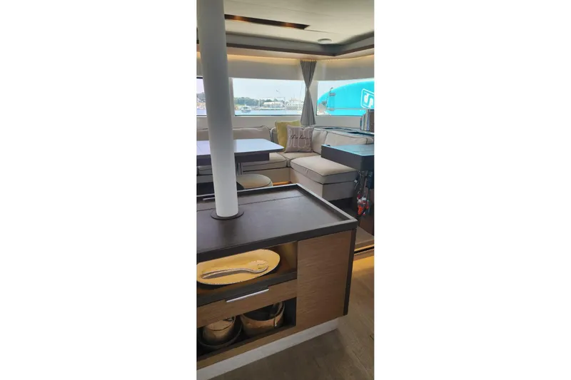 Slide: The Image of Interior of 2023 Lagoon 50 yacht with modern seating and dining area. - 28