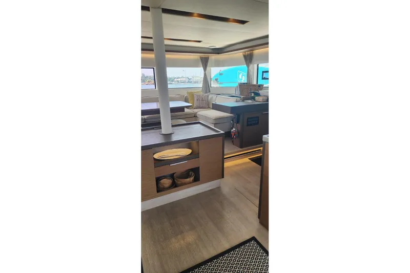 Slide: The Image of Interior of 2023 Lagoon 50 yacht, featuring modern design and spacious seating area. - 29