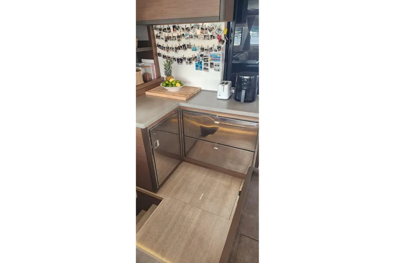 Slide: The Image of Modern kitchen in 2023 Lagoon 50 yacht with stainless steel appliances and decor. - 36