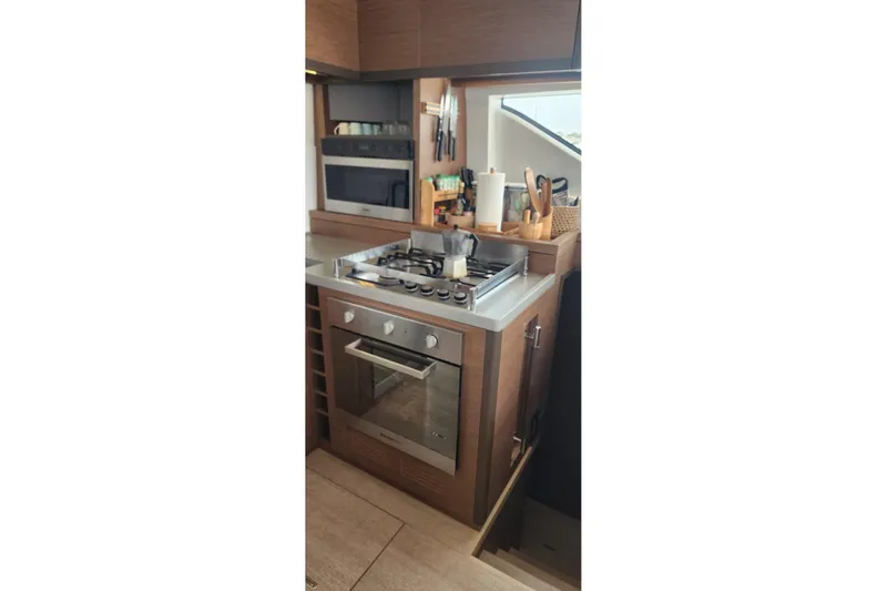Slide: The Image of Modern kitchen in 2023 Lagoon 50 yacht with stove and oven. - 37