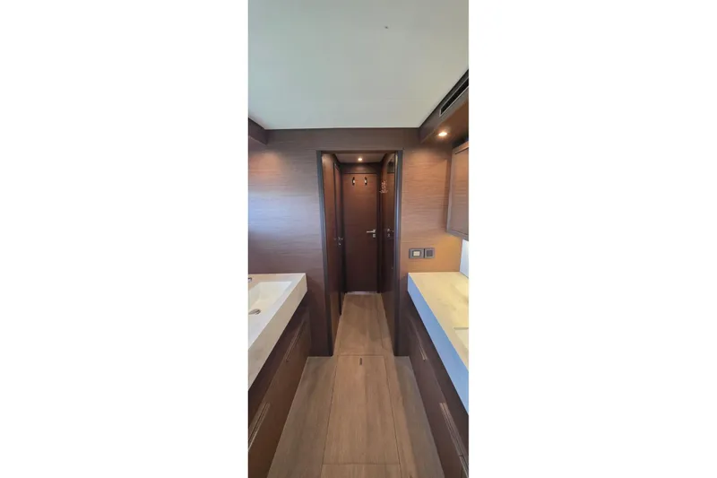 Slide: The Image of Interior of 2023 Lagoon 50 yacht, featuring modern wood finishes and sleek design. - 40