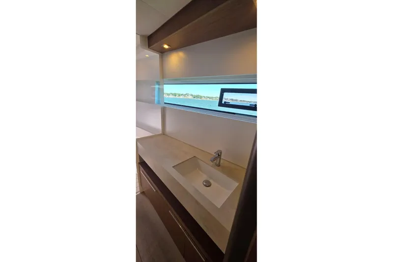Slide: The Image of Modern bathroom interior of 2023 Lagoon 50 yacht with ocean view window. - 42