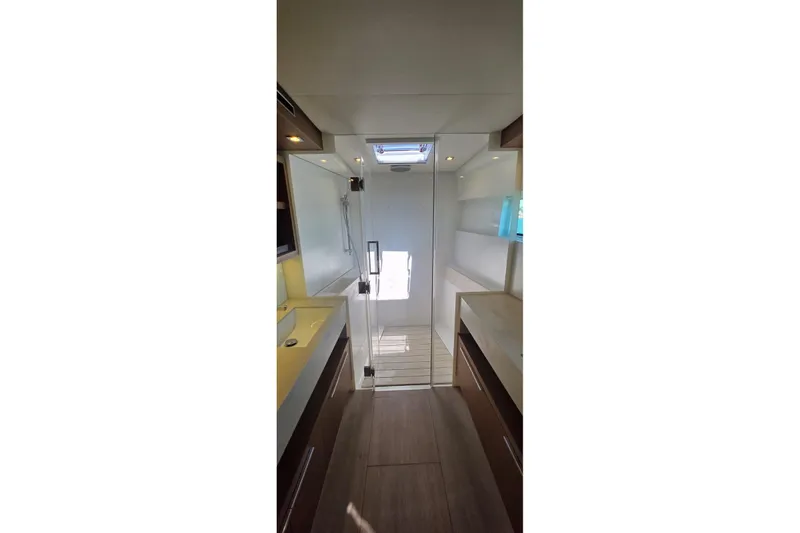 Slide: The Image of Interior of 2023 Lagoon 50 yacht bathroom with modern fixtures and glass shower door. - 43