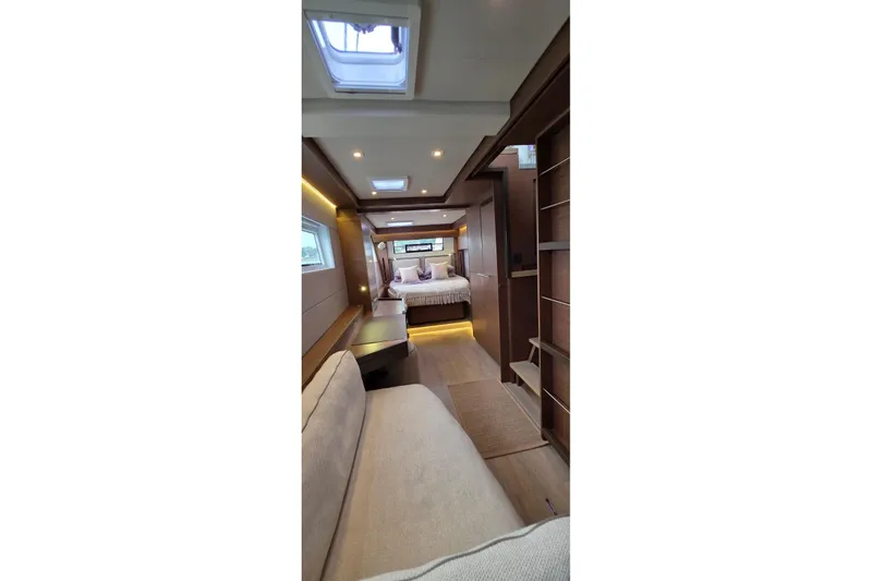 Slide: The Image of Luxurious interior of 2023 Lagoon 50 yacht, featuring elegant wood finishes and modern design. - 48