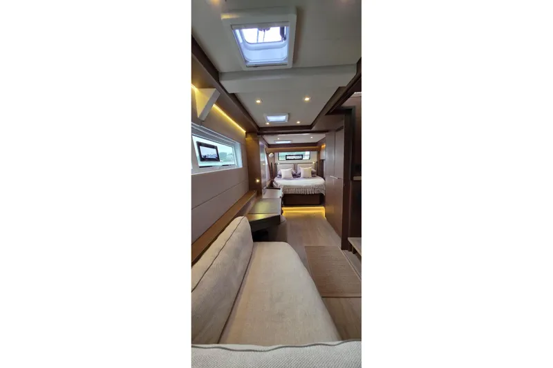 Slide: The Image of Luxurious interior of 2023 Lagoon 50 yacht with cozy seating and elegant bedroom. - 49