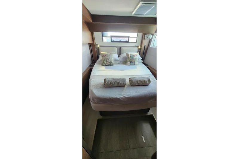 Slide: The Image of Luxurious bedroom interior of 2023 Lagoon 50 yacht with cozy bedding and elegant decor. - 61