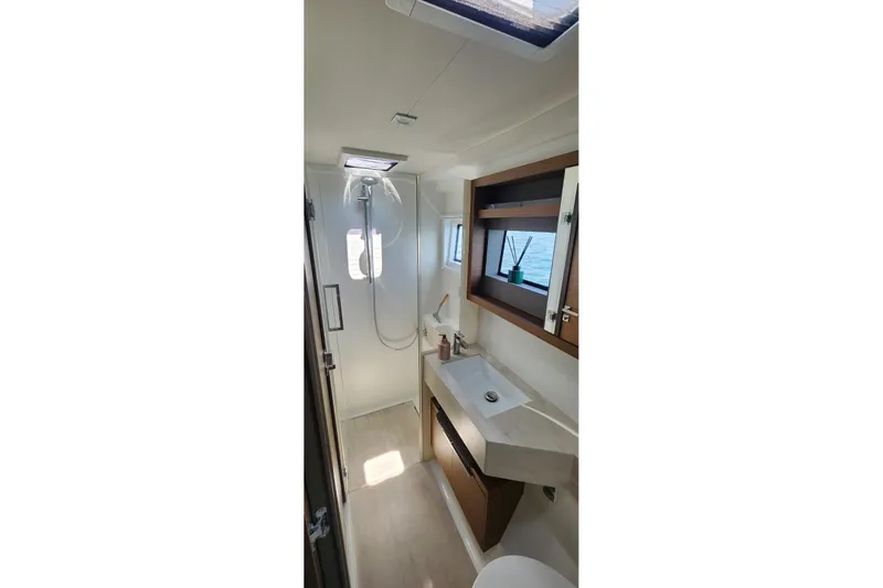 Slide: The Image of Modern bathroom interior of 2023 Lagoon 50 yacht, featuring sleek design and natural light. - 66