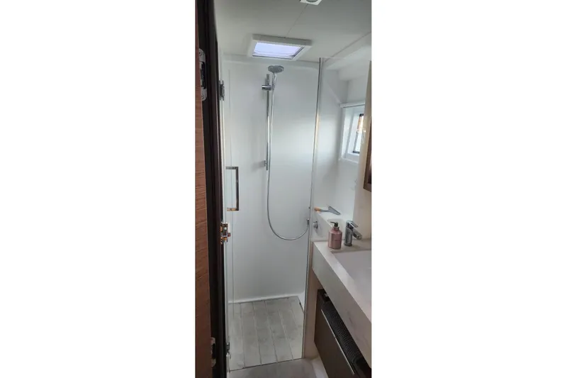 Slide: The Image of Modern bathroom interior of 2023 Lagoon 50 yacht with shower and sink. - 70