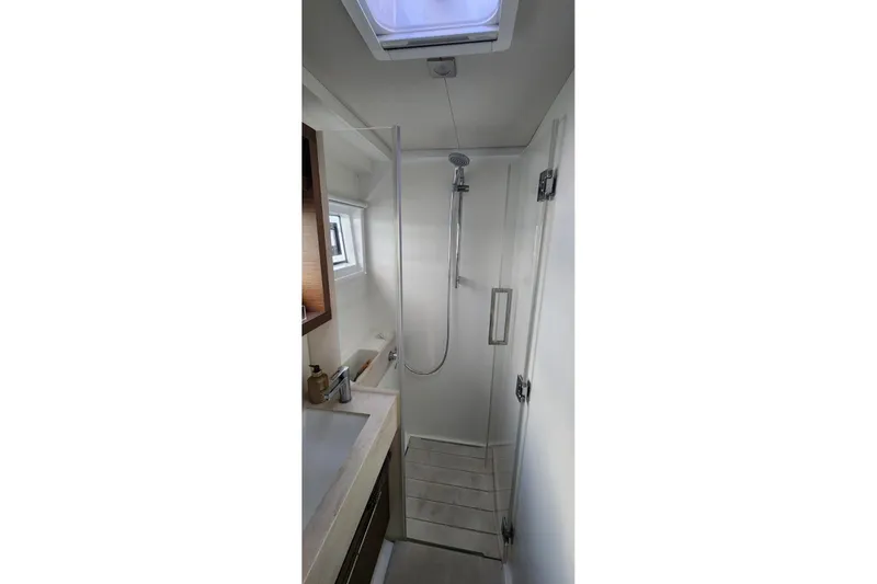 Slide: The Image of Modern bathroom in 2023 Lagoon 50 yacht with shower and sink. - 73