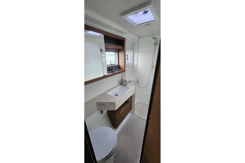 Slide: The Image of Modern bathroom interior on 2023 Lagoon 50 yacht, featuring sleek design and natural lighting. - 74
