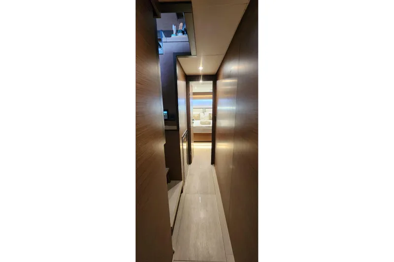 Slide: The Image of Interior hallway of 2023 Lagoon 50 yacht, featuring sleek wooden paneling and modern design. - 75