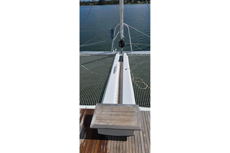 Slide: The Image of 2023 Lagoon 50 catamaran deck with netting and anchor chain. - 8