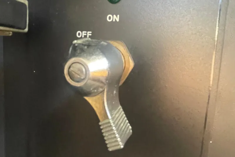 Slide: The Image of Close-up of a metal switch on a 2001 Bayliner 3388 Command Bridge Motoryacht. - 12