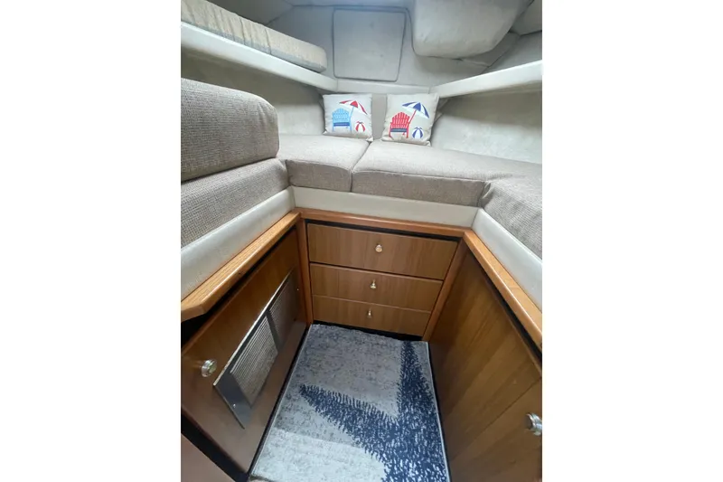 Slide: The Image of 2001 Bayliner 3388 Command Bridge Motoryacht interior with cozy cabin and nautical decor. - 14