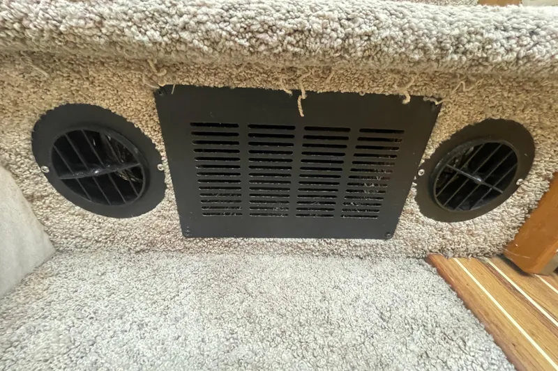 Slide: The Image of Carpeted interior of 2001 Bayliner 3388 Command Bridge Motoryacht with ventilation grilles. - 22