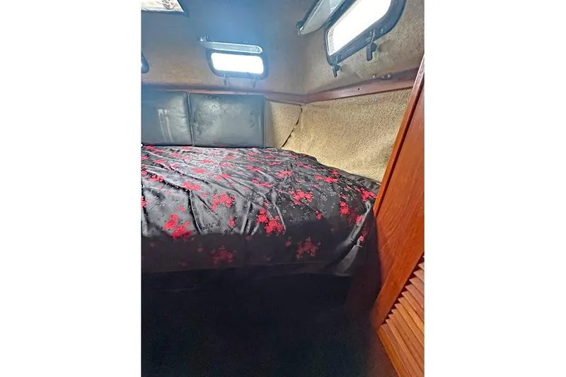 The Image of Cozy cabin interior of 1982 S 2 9.2C sailboat with floral bedding. - 1