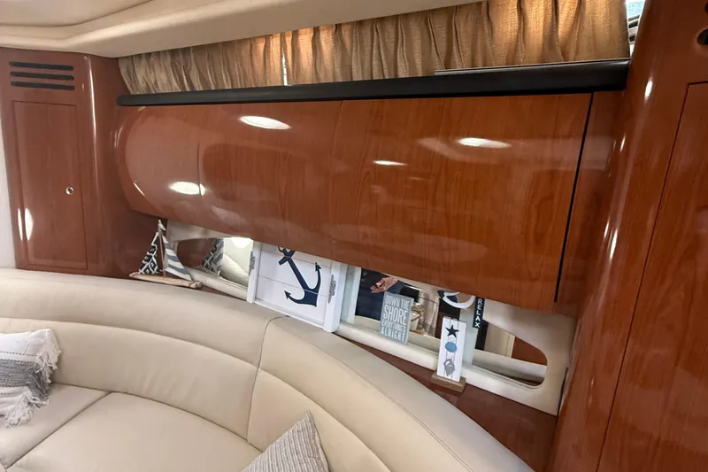 Slide: The Image of Luxurious interior of 2002 Sea Ray 360 Sundancer with wood finish and comfortable seating. - 21