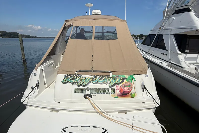 Slide: The Image of 2002 Sea Ray 360 Sundancer docked, featuring "Lazy Days" signage, North Brunswick, NJ. - 3