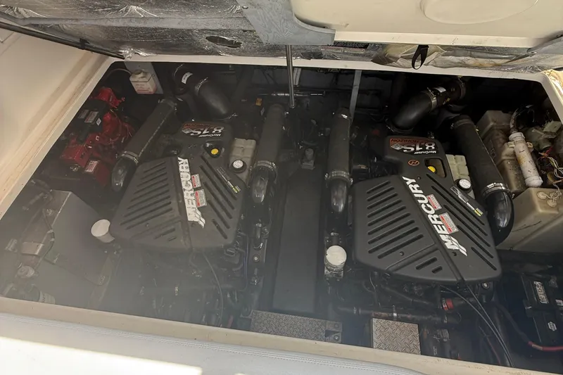 Slide: The Image of Engine compartment of a 2002 Sea Ray 360 Sundancer with twin Mercury engines. - 36