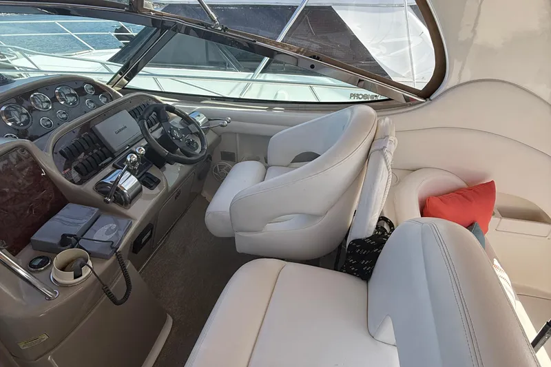 Slide: The Image of Interior of 2002 Sea Ray 360 Sundancer yacht with helm and seating area. - 8