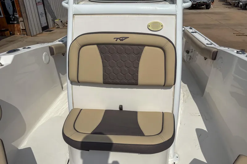 Slide: The Image of 2020 Tidewater 232 CC Adventure boat seating with beige and brown upholstery. - 13