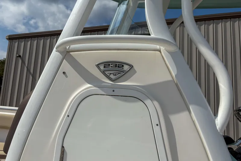 Slide: The Image of 2020 Tidewater 232 CC Adventure boat detail with emblem and structure. - 3