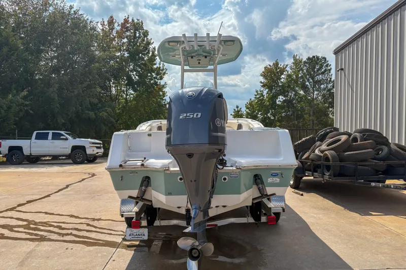 Slide: The Image of 2020 Tidewater 232 CC Adventure boat with Yamaha 250 engine, parked outdoors. - 4