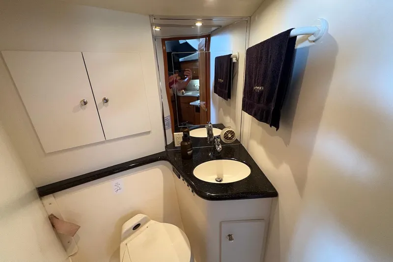 Slide: The Image of Bathroom interior of 2002 Carver 406 Aft Cabin Motor Yacht with sink and mirror. - 23