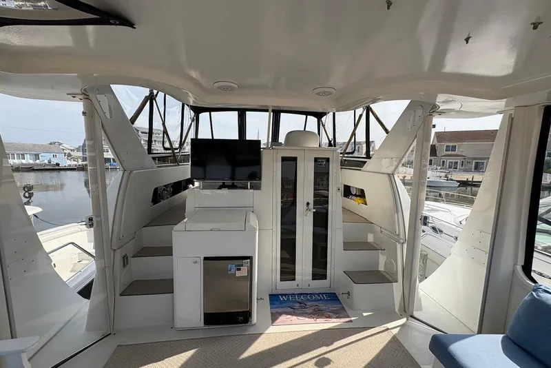 Slide: The Image of Interior of 2002 Carver 406 Aft Cabin Motor Yacht with TV and seating area. - 5