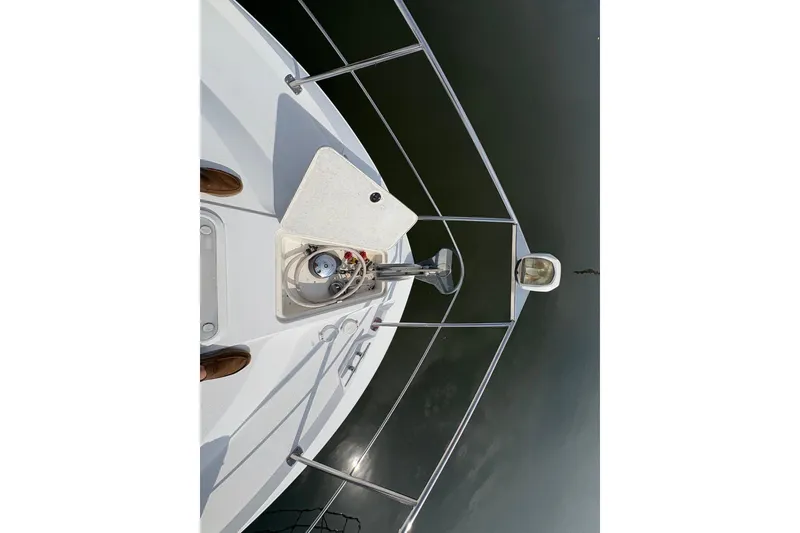 Slide: The Image of Bow view of 2002 Carver 406 Aft Cabin Motor Yacht with anchor and railing. - 12