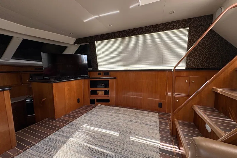Slide: The Image of Luxurious interior of 2002 Carver 406 Aft Cabin Motor Yacht with wood finishes and modern amenities. - 15