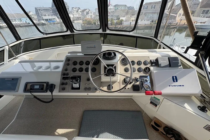 Slide: The Image of Helm of 2002 Carver 406 Aft Cabin Motor Yacht with navigation equipment and steering wheel. - 7