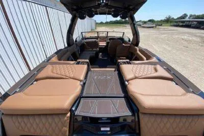 Slide: The Image of 2026 Tigé 24RZX boat interior with luxurious tan seating and sleek design. - 6