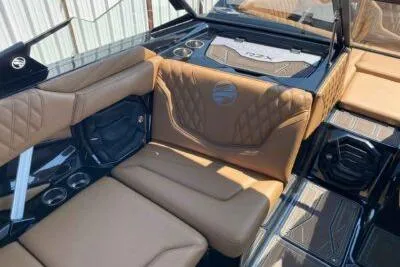 Slide: The Image of 2026 Tigé 24RZX boat interior with tan leather seating and modern design elements. - 8