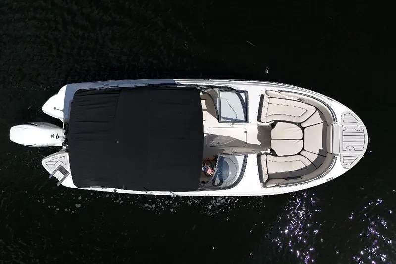Slide: The Image of Aerial view of 2021 Stingray 231 DC boat on dark water. - 13