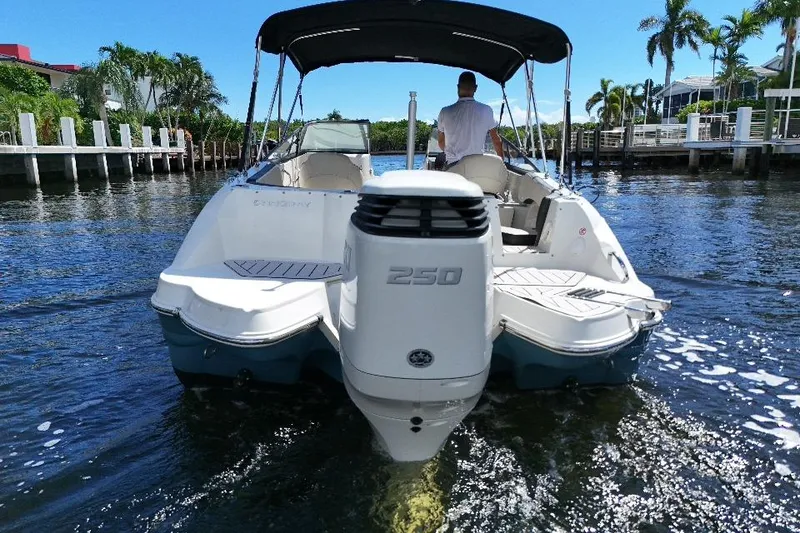 Slide: The Image of 2021 Stingray 231 DC boat with 250 HP engine cruising on a sunny day. - 4